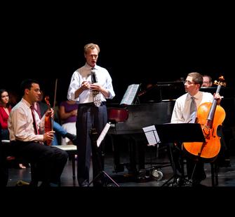Rusty from the Saint Michael Trio discussing his group's work and music.